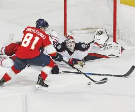  ??  ?? SUNRISE: Jonathan Marchessau­lt #81 of the Florida Panthers is unable to score against goaltender Sergei Bobrovsky #72 of the Columbus Blue Jackets during the overtime period at the BB&T Center on Saturday in Sunrise, Florida. The Panthers defeated the...