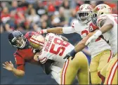  ?? BOB LEVEY — GETTY IMAGES; TIM WARNER — GETTY IMAGES ?? Jimmy Garoppolo fades back to pass; Texans QB Tom Savage is levelled by Elvis Dumervil of the 49ers.