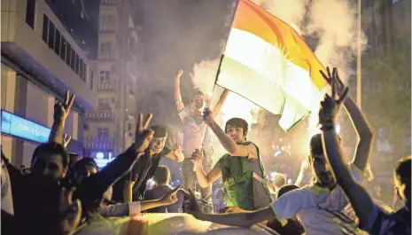  ?? BULENT KILIC, AFP/GETTY IMAGES ?? People waving a Kurdish flag in Diyarbakir, Turkey, celebrate election results Sunday.