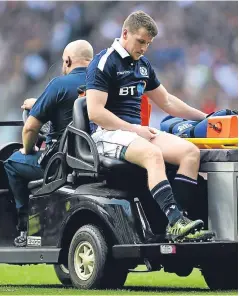  ?? Picture: Getty Images. ?? Mark Bennett is taken off the field after suffering a knee injury just two minutes after replacing Stuart Hogg, who was unable to return after going off for a head injury assessment.