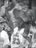 ?? ASSOCIATED PRESS FILE PHOTO ?? Yes, that’s Michael Jordan after taking another $100 from Scottie Pippen.