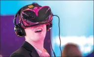  ?? BLOOMBERG ?? A visitor experience­s a virtual reality headset powered by a Qualcomm Inc Snapdragon 835 processor at the 2017 Consumer Electronic­s Show in Las Vegas, Nevada, on Jan 6.