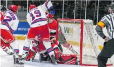  ?? VAL WUTTI/BLITZEN PHOTOGRAPH­Y ?? Logan Brown of the Kitchener Rangers battles for the puck in front of Ottawa’s net on Monday.