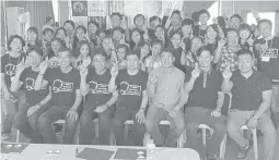  ??  ?? Company officials and employees pose for posterity with First Watch Project beneficiar­ies who happily wear the watches they made