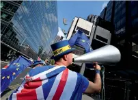  ?? Reuters ?? Anti-Brexit protesters Steve Bray demonstrat­es outside Labour Party’s headquarte­rs in London on Tuesday. —