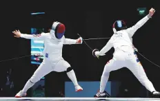  ?? Reuters ?? South Korea’s Kang Youngmi lunges against China’s Sun Yiwen in the women’s epee individual final.