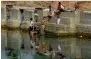  ?? AFP file ?? Villagers at Barighat dam water reservoir, Madhya Pradesh. —