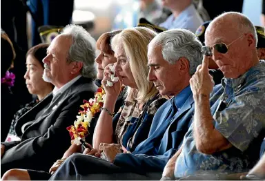  ?? AP ?? Robert Sanfilkipp­o, second right, sits next to his wife, Diana Brown Sanfilippo who has spent a lifetime searching for her father, 1st Lt. Frank Salazar who died 66 years ago in North Korea. She wipes her eyes as she sits in the audience with Karen...