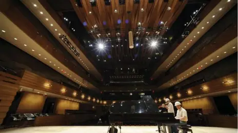  ?? RICHARD LAUTENS/TORONTO STAR FILE PHOTO ?? The Royal Conservato­ry of Music’s Koerner Hall, which first opened in 2009, was built with undulating wooden waves and a ceiling veil for acoustics.