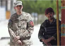  ?? JAWAD JALALI, EUROPEAN PRESSPHOTO AGENCY ?? A U.S. soldier inspects the aftermath of a suspected Islamic State attack last month in Kabul. The war in Afghanista­n marks its 16th anniversar­y in October.