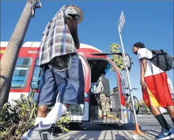  ?? Al Seib Los Angeles Times ?? RIDERSHIP HAS declined on Metro buses and other transit systems in part because of lower gas prices and ride-hailing services. The biggest factor may be a surge in vehicle ownership, a UCLA study found.