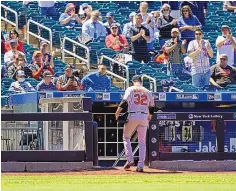  ?? KATHY WILLENS/ASSOCIATED PRESS ?? Fans stand and applaud as Baltimore Orioles starting pitcher Matt Harvey leaves the mound and returns to the dugout during the fifth inning against his former team, the New York Mets, on Wednesday in New York.