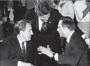  ?? Democrat-Gazette file photo ?? Dale Bumpers (left) and David Pryor (right), both Democratic U.S. senators in January 1984, talk with Gov. Bill Clinton at an event in Arkansas.