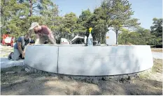  ?? JULIE JOCSAK/POSTMEDIA NEWS ?? Scott Harris, left, and Daly Drevniok, stone carvers from Smith and Barber Sculpture Atelier, work on the First Nations Peace Monument.