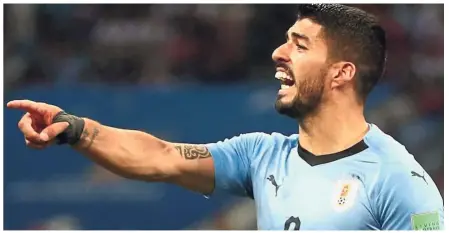  ??  ?? I won’t bite: Uruguay’s Luis Suarez, once the troublemak­er, is now a veteran and a role model. — Reuters