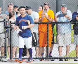  ?? Jeff Roberson The Associated Press ?? Astros second baseman Jose Altuve walks away after signing autographs Thursday at FITTEAM Ballpark of the Palm Beaches. Houston’s first full workout is Monday.