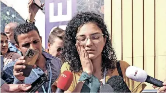  ?? | EPA ?? SANAA Seif, the sister of jailed British-egyptian activist Alaa Abd el-fattah, speaks to media on the sidelines of the UN Climate Change Conference in Sharm el-sheikh, Egypt, this week, where she has been campaignin­g for his release.