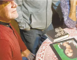  ?? CAL CARY/THE WASHINGTON POST ?? Perry Botto and his family gather in December to remember daughter Jeanette Botto and her mother Teresa.