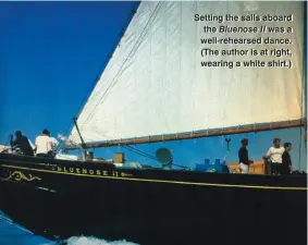  ??  ?? Setting the sails aboard the Bluenose II was a well-rehearsed dance. (The author is at right, wearing a white shirt.)