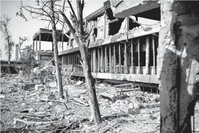  ?? Associated Press ?? An external view of Mosul’s main hospital complex on Tuesday shows damage after it was retaken by Iraqi forces during fighting against Islamic State militants in Mosul, Iraq.