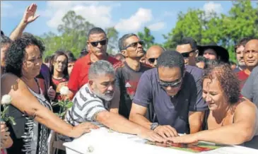  ?? REUTERS ?? Relatives of Vinicius de Barros Silva Freitas, one of the Flamengo trainees, attend his burial, in Volta Redonda, Brazil on Saturday.