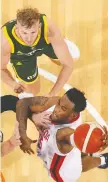  ?? PAUL KANE/GETTY IMAGES ?? Oshae Brissett of Canada drives to the basket against Australia during an internatio­nal basketball friendly match on Friday in Perth, Australia.