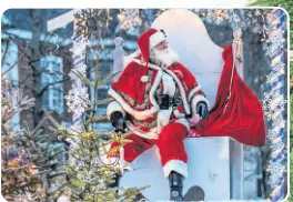  ?? PHOTO CREDIT: Linda Chisholm ?? Santa Claus greets the spectators who came out for the 2019 Santa Claus Parade in Downtown Truro.