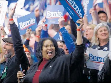  ?? Photos / AP ?? Supporters at Bernie Sanders’ election night rally in Manchester celebrate yesterday.