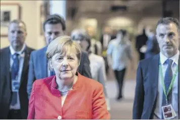  ?? Jasper Juinen / Bloomberg ?? Angela Merkel, Germany’s chancellor, and EU leaders have reportedly agreed to measures to stem the flow of migrants into the bloc and spread the burden of handling those who do come.