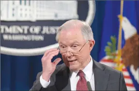  ?? Associated Press photo ?? Attorney General Jeff Sessions speaks during a news conference at the Justice Department in Washington, Thursday. Sessions said he will recuse himself from a federal investigat­ion into Russian interferen­ce in the 2016 White House election.