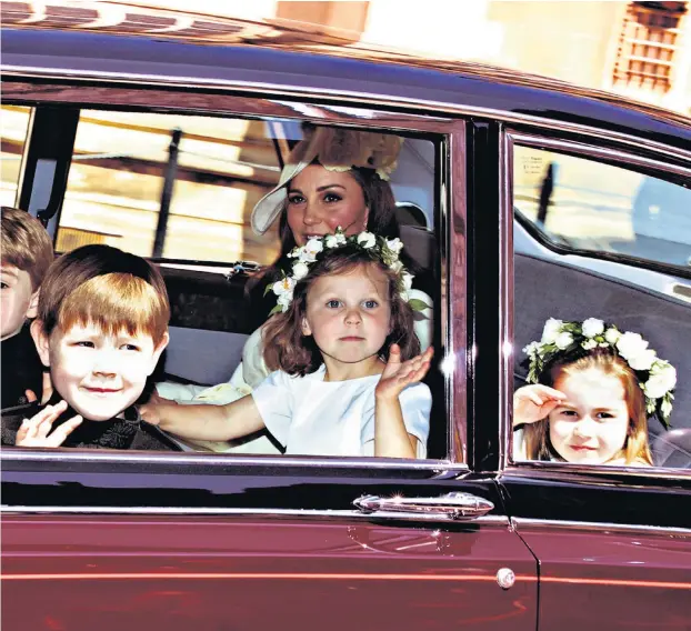  ??  ?? LITTLE STARS Meghan chose children for her bridal party: above, they arrive with the Duchess of Cambridge; after a messy dress rehearsal, far left twins Brian and John were given the task of holding the bride’s veil; left Maria Borrallo holds Zalie...