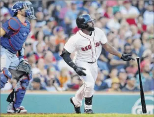  ?? Michael Dwyer / Associated Press ?? Boston’s Jackie Bradley Jr., right, watches his two-run double in front of Mets’ catcher Kevin Plawecki during the fifth inning at Fenway Park on Saturday.