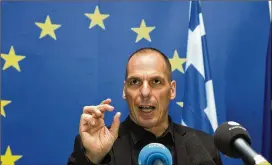  ?? VIRGINIA MAYO / ASSOCIATED PRESS ?? Greek Finance Minister Yanis Varoufakis speaks during a media conference after a meeting of eurogroup finance ministers at the European Council building in Luxembourg in 2015. Bailout negotiator­s reached the provisiona­l agreement in Athens on Saturday.