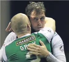  ??  ?? Grant Holt celebrates scoring Hibs’ second goal of the game with team-mate David Gray against Hearts.