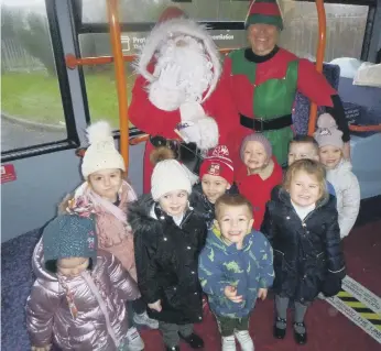 ?? ?? Children from Pennywell Early Years Centre aboard the festive Stagecoach bus with Santa and Big Elf.