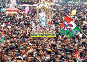  ?? PTI ?? Trinamool Congress workers display a cutout of west bengal Chief Minister Mamata banerjee during the annual Martyr’s Day rally in Kolkata on Saturday. —