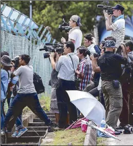  ?? EPA ?? Mediamen wait outside Sepang District Police headquarte­rs, where three suspects in the death of Kim Jong-nam are kept.