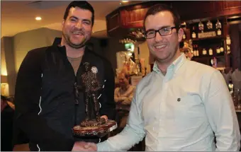 ??  ?? Tim Corbett, Vice Chairman of Kanturk &amp; District Trout Anglers Associatio­n, presenting the Angler of the Year Award to Declan O’Sullivan, Kilbrin.