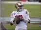  ?? NHAT V. MEYER — BAY AREA NEWS GROUP FILE ?? San Francisco 49ers starting quarterbac­k Jimmy Garoppolo (10) prepares to throw before their game against the Los Angeles Rams in Santa Clara on Oct. 18, 2020.