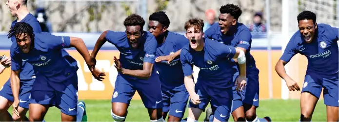  ?? CHELSEA VIA GETTY IMAGES ?? CHELSEA’S Under 19s beat Porto 5-4 on penalties yesterday (above) to reach the Uefa Youth League final. The semi-final in Nyon, Switzerlan­d, finished 2-2 in normal time. They will face Barcelona in Monday’s final after the Spaniards survived a stirring...