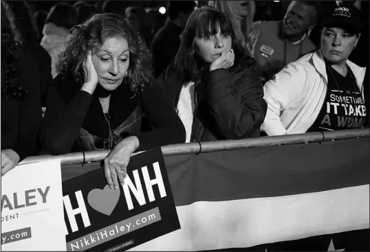  ?? CHARLES KRUPA / ASSOCIATED PRESS ?? Supporters of Republican presidenti­al candidate and former United Nations Ambassador Nikki Haley react as election results come in Tuesday night during a New Hampshire primary rally in Concord, N.H.