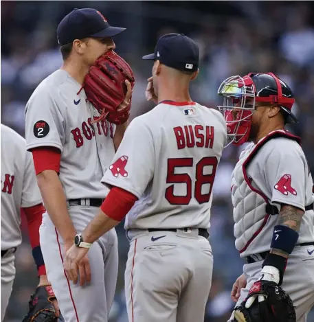  ?? Ap ?? PEP TALK: Starting pitcher Nick Pivetta gets a visit on the mound from pitching coach Dave Bush after giving up a two-run homer to Anthony Rizzo on Saturday at Yankee Stadium.