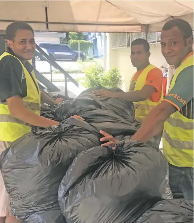  ?? Photo: Nacanieli Tuilevuka ?? Fiji Red Cross Society Suva Branch Volunteers; Alitia Waqa, Josevata Laqere and Rusiate Delai packing clothes to take to Kadavu at the National Office on March 12, 2018.