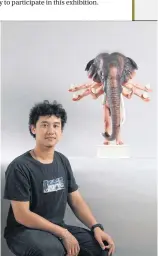  ??  ?? Young artist Parada Pattarakun­preeda with his interpreta­tion of Lord Ganesha.