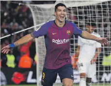  ?? Reuters ?? Barcelona striker Luis Suarez celebrates after completing his hat-trick against Real Madrid in yesterday’s el clasico