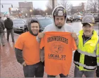  ?? Joseph B. Nadeau/The Call ?? From left, Marvin Gutierrez, Michael Sanchez Reyes and Eddie Lachance were among the members of Local 27 of the Internatio­nal Associatio­n of Bridge, Structural, Ornamental and Reinforcin­g Iron Workers showing up at the Statehouse in support of Governor...