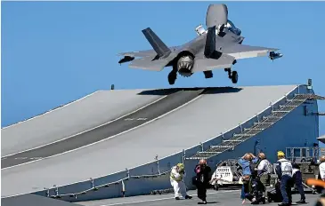  ??  ?? F-35 jets operate from Britain’s newest aircraft carrier, HMS Queen Elizabeth, in the eastern Mediterran­ean.