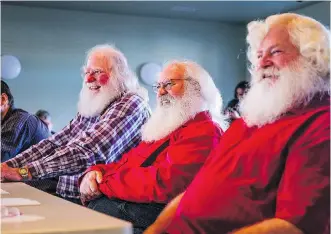  ?? MCINTOSH /THE CANADIAN PRESS PHOTOS: JEFF ?? Bob Slocombe, left, Dan Dickison, centre, and Jeff Badyk listen to instructor­s at Santa School.