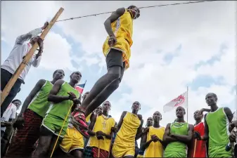  ?? ?? A Maasai man competes in the high-jump competitio­n at the Maasai Olympics in Kimana Sanctuary.