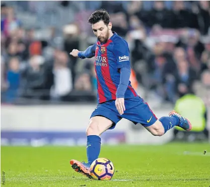  ??  ?? Barcelona’s Lionel Messi scores a penalty during the La Liga game against Leganes last Sunday.